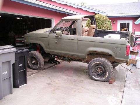 1986 Ford Bronco II - This 1986 Ford Bronco II is undergoing some work, with its top removed and lifted on jacks.