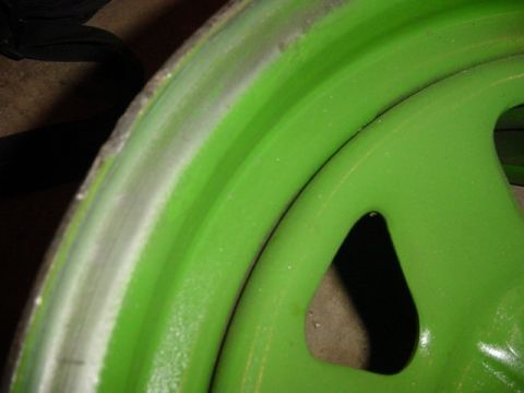 1992 Ford Bronco - Close-up of a custom green beadlock wheel, the Supermotors logo at the bottom right.