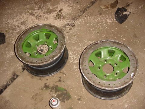 1992 Ford Bronco - Custom wheels with beadlock rings are shown, possibly for an off-road vehicle, with a spray can nearby.