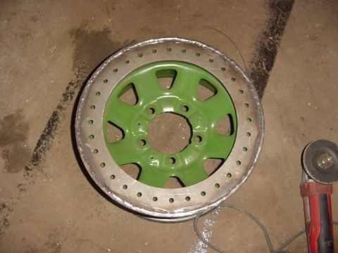 1992 Ford Bronco - Custom wheel modification in progress with an angle grinder nearby.