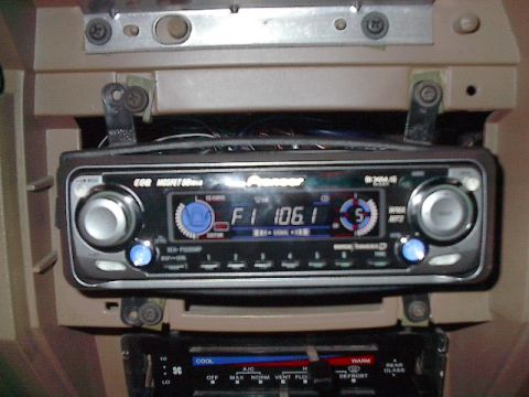 1986 Ford Bronco - The plastic DIN installation plate was not what you'd call properly centered. A little heat and installing the left screws inside the bars…
