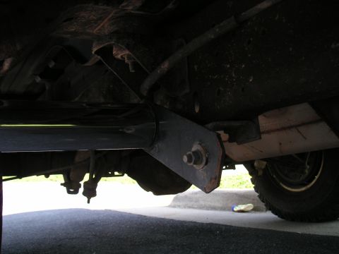 1994 Ford Bronco - This photo shows the undercarriage of a vehicle, focusing on the step bars and suspension components.