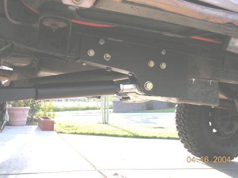1994 Ford Bronco - Underside view of a vehicle's suspension system, showing custom modifications.