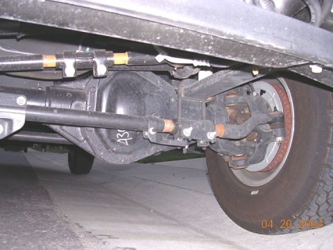 1994 Ford Bronco - Undercarriage view of a vehicle's rear axle and suspension system, with a date stamp of 04.20.2004.