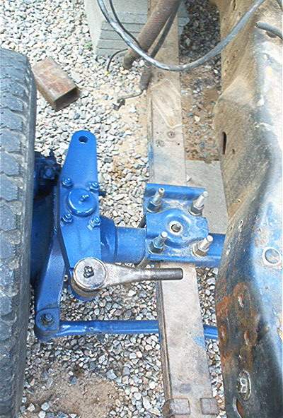 1986 Ford Bronco - The vehicle's steering linkage, painted bright blue, is shown in detail.