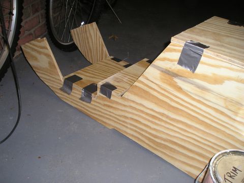 1996 Ford Bronco - A custom center console constructed from plywood, held together with duct tape, is shown in a garage setting.
