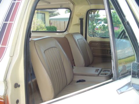 1979 Ford Bronco - Interior of a 1979 Ford Bronco, tan seats and wood-grain trim.