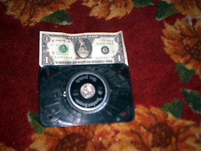 1995 Ford Bronco - backside of the tweeter, with a dollar bill and a quarter in the center for comparison, the magnet on these are HUGE