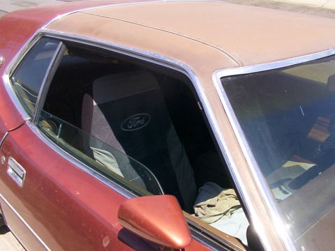 1973 Mercury Cougar - Slightly update interior from last may. Ford seat covers, a fixed driver's seat, and a leapord spot steering wheel cover.