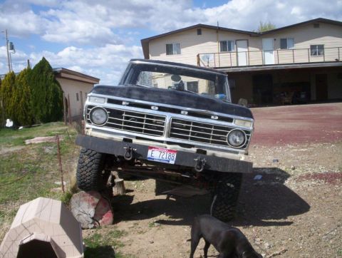 1978 Ford Bronco - This 1973 Ford F-Series truck features a prominent grille and a lifted suspension.