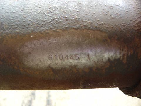 1993 Ford Bronco - A close-up view of a metal part with stamped identification numbers.