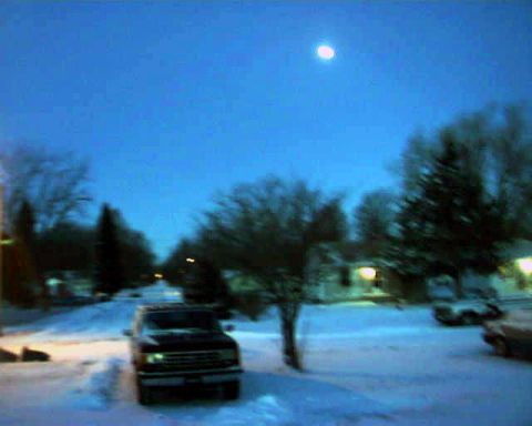 1988 Ford C-350 (Centurion Conversions) - Ford F-Series truck parked on a snow-covered street under a twilight sky with the moon visible.
