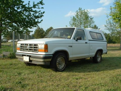 1992 Ford Ranger - This 1992 Ford Ranger pickup truck is shown in a 3q front view, equipped with a camper shell.