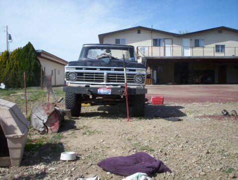 1978 Ford Bronco - This truck, likely a 1973 Ford F-Series, is parked outside a residential building on a sunny day.