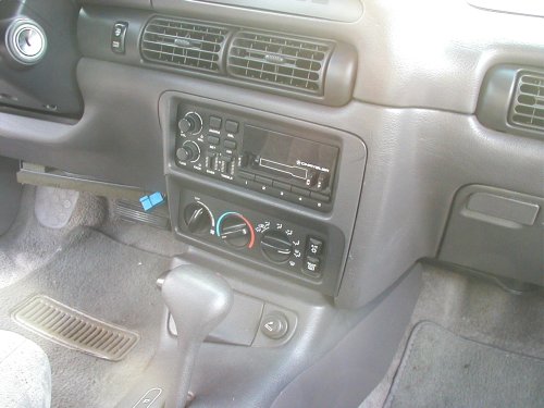 1995 Dodge Intrepid interior showing dashboard, center console with radio and climate controls, and gear shifter