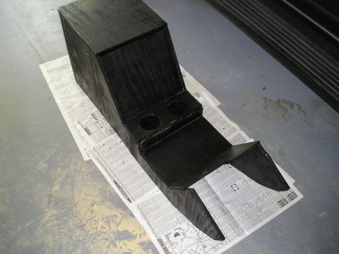 1996 Ford Bronco - A custom-made black center console, two cup holders, is shown placed on top of newspapers.