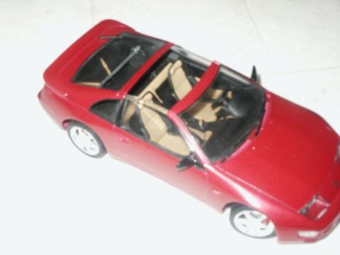 1998 Mercury Sable - A red convertible model car with a tan interior is shown from a high angle.