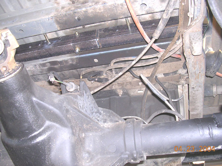 the top of the angle is close to the uderside of the body, thats why its in two pieces.  Has to be bolted together once they are slid in from the bottom.   they sit on top of the frame rails