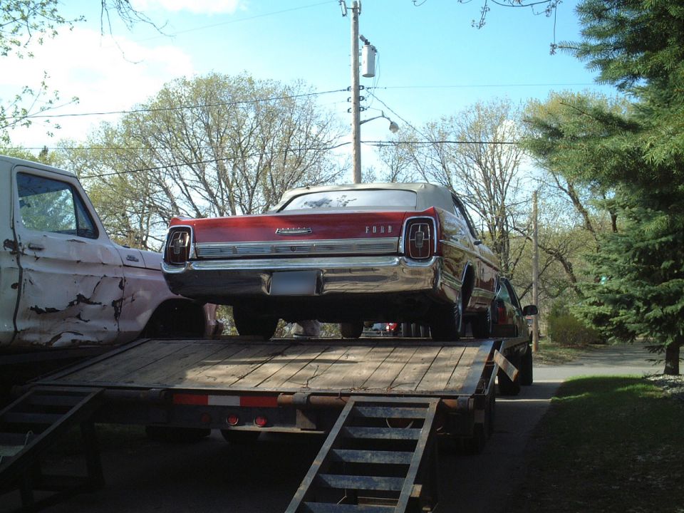 Winching her onto the trailer for the ride home.