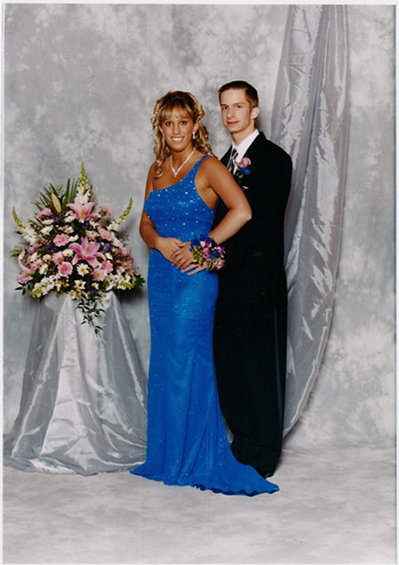 2000 Jeep Liberty - A couple poses for a formal photo, likely at a school dance or event.