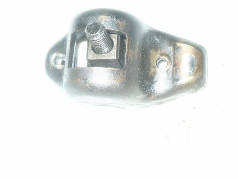 1984 Ford Bronco - Close-up of a single rocker arm, likely from an engine, with visible adjustment screw and mounting holes.