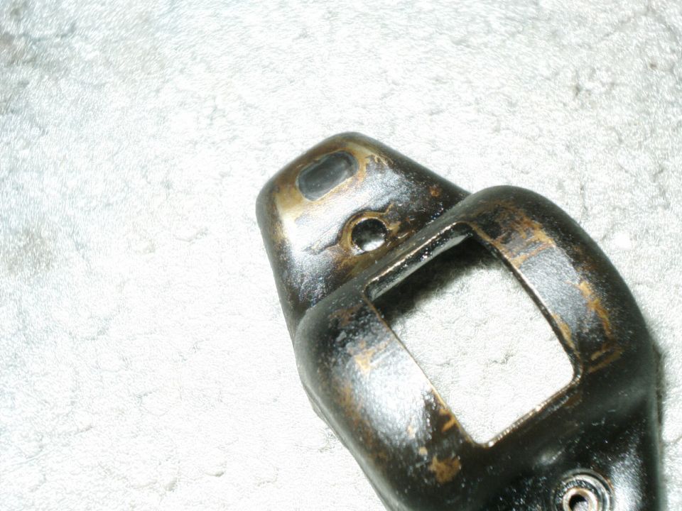 close-up of a metal engine rocker arm, appears used