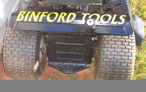 1979 Ford Bronco - This lawnmower features the "Binford Tools" logo on its rear panel and has distinctive knobby tires.