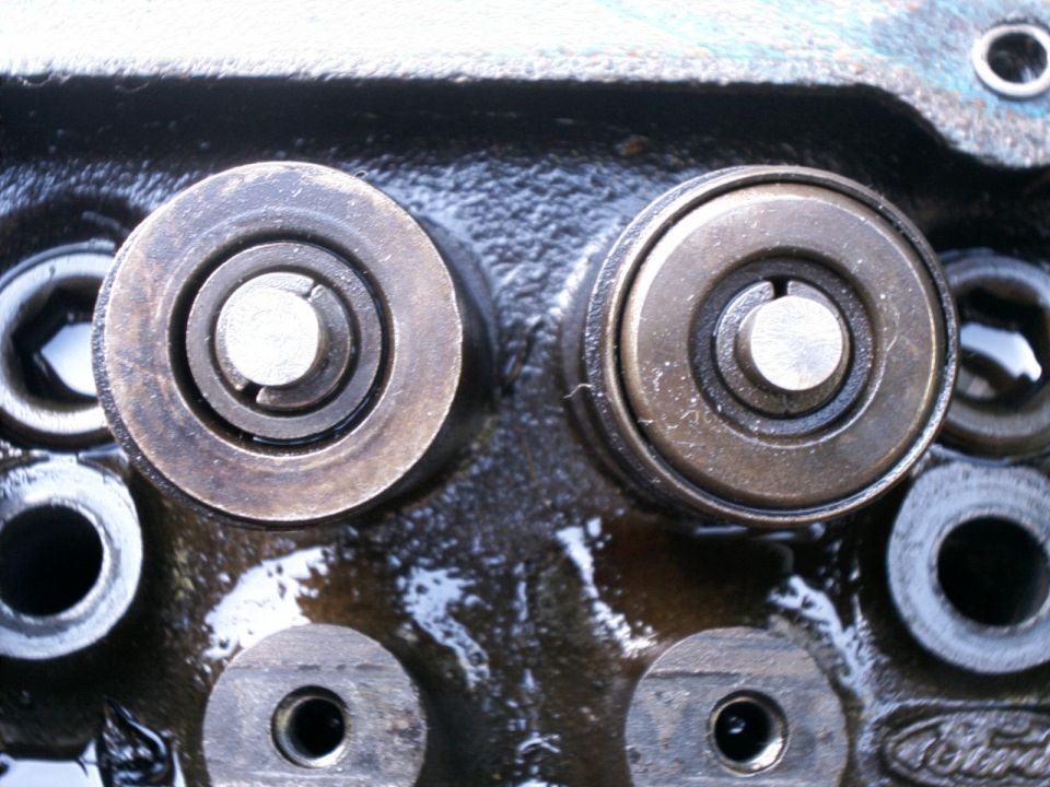 Close-up of valve stem caps on an engine block