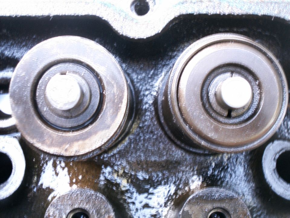close-up of two valve springs and retainers on an engine block