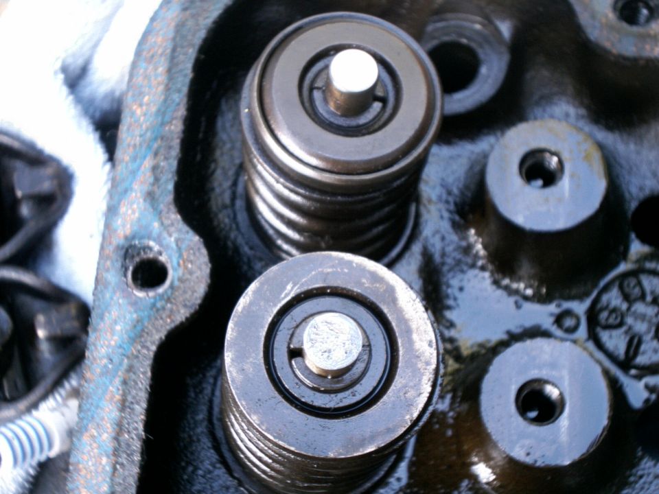 Close-up of valve springs, retainers and valve stem tips on a cylinder head