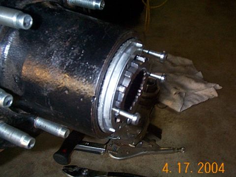 1986 Ford Bronco - Close-up view of a front axle hub assembly, likely undergoing maintenance or modification.