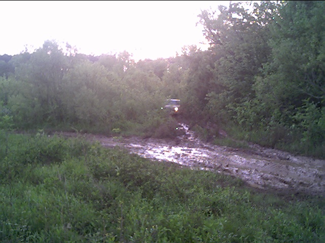 sequence of snapshots. this sequence shows thumper coming out of the back trail. its great wheeling, but its so grown up that you cant see a thing...jeeps love the narrow trails. 
this was taken on next to flint river. the water is from the river overflowing into the lowlands.

1 of 10