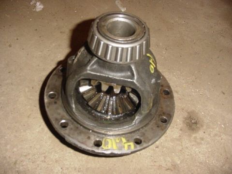 1992 Ford Bronco - A differential part with visible yellow markings and gears is shown.