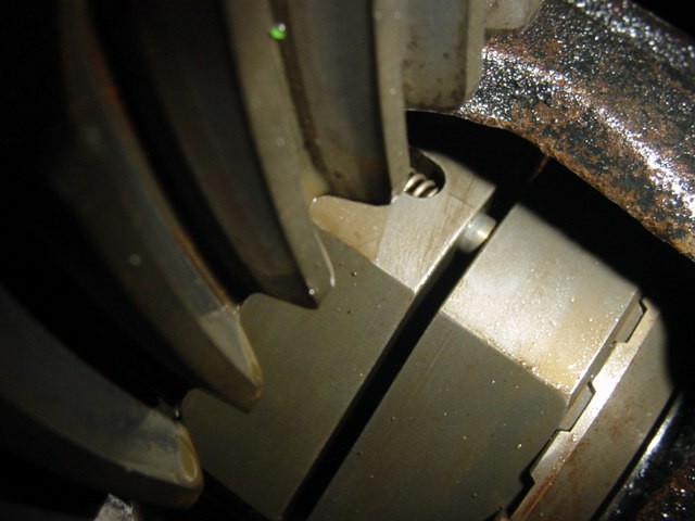 Close-up of differential gears with visible wear and oil