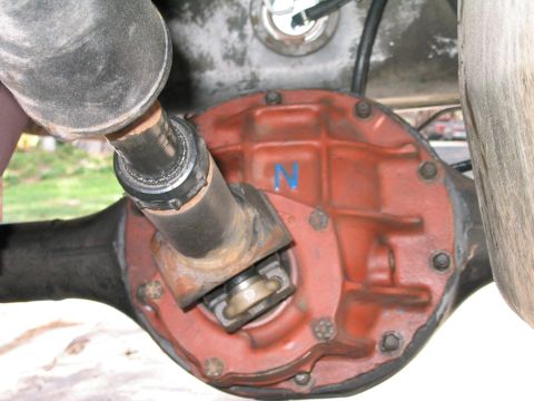 1969 Ford Bronco - Close-up view of a vehicle's rear differential and driveshaft, showing a blue 'N' marking on the differential cover.