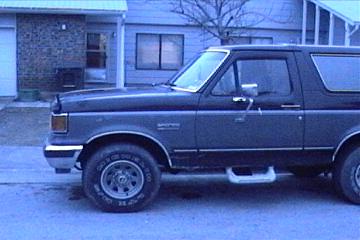 1989 Ford Bronco - This 1989 Ford Bronco is shown from the side, its distinctive two-tone paint and body style.