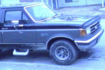 1989 Ford Bronco - This 1989 Ford Bronco is shown from the front quarter angle, highlighting its side profile and wheel.