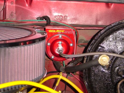 1978 Ford Bronco - An Auto Meter Fuel Gauge Isolator is visible in the engine bay, alongside an air filter and various hoses and wires.
