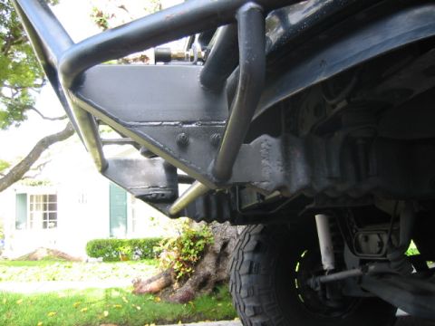 1992 Ford Bronco - Close-up view of the undercarriage and custom bumper of an off-road vehicle.