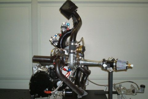 1985 Ford LTD Crown Victoria - A custom turbocharged engine assembly is displayed, intricate plumbing and a prominent turbocharger unit.
