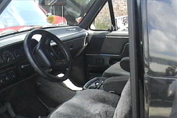 1989 Ford Bronco - Interior view of a 1989 Ford Bronco, highlighting the dashboard and seating area.