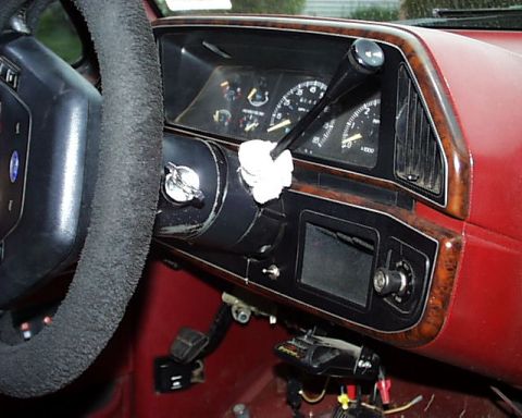 1988 Ford C-350 (Centurion Conversions) - Dashboard view of a 1988 Ford C-350 (Centurion Conversions) interior, wood grain trim and gauges.