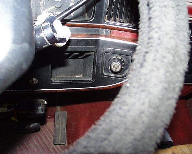 Close-up of truck lower dash, woodgrain trim and taped turn-signal stalk