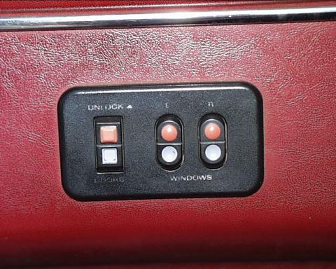 1988 Ford C-350 (Centurion Conversions) - Interior view of the power window and lock controls in a 1988 Ford C-350 Centurion Conversions.