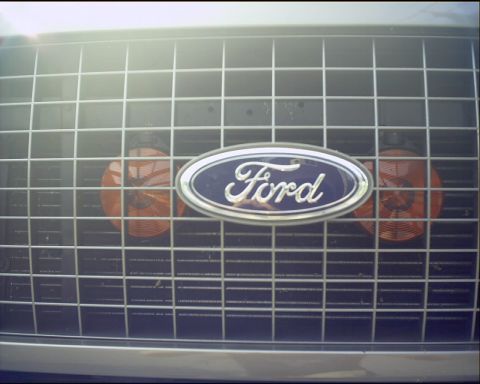 2003 Ford Excursion - Close-up of the front grille on a 2003 Ford Excursion, showing the Ford logo and marker lights.