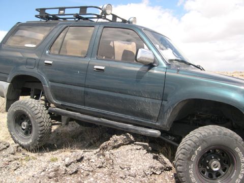 1978 Ford Bronco - This SUV is equipped for off-road adventures with a roof rack and large tires.