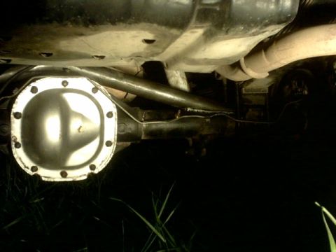 1995 Ford Bronco - Underside view of a vehicle's rear differential and exhaust system, with visible text from Supermotors.net.