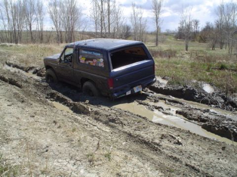 1981 Ford Bronco - trying to knock down the high center... to no avail you just slip into the goop.