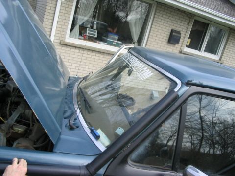 1986 Ford Bronco - Front passenger side view of a 1986 Ford Bronco with the hood up.