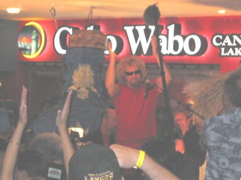 1989 Ford Bronco - Sammy Hagar performs live on stage at the Cabo Wabo Cantina, with a crowd cheering him on.